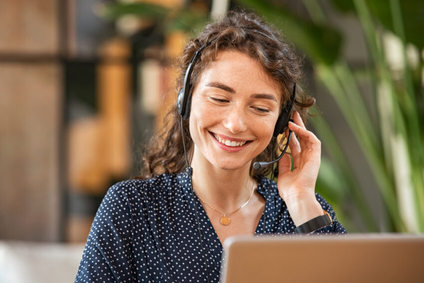 woman giving customer service on computer